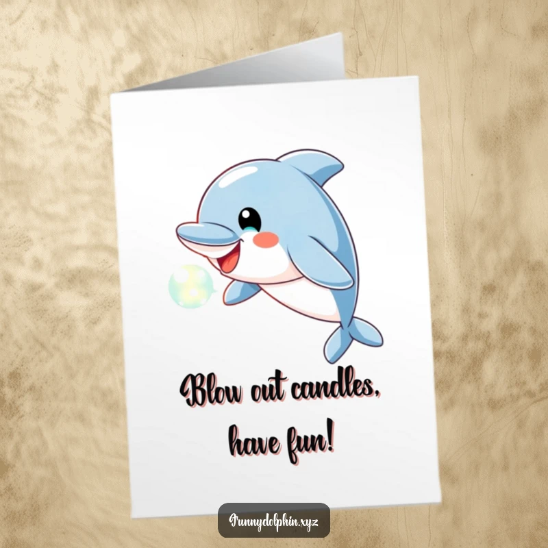 Free Printable Birthday Card: A playful dolphin with a cheerful expression blows a beautiful bubble of light.
